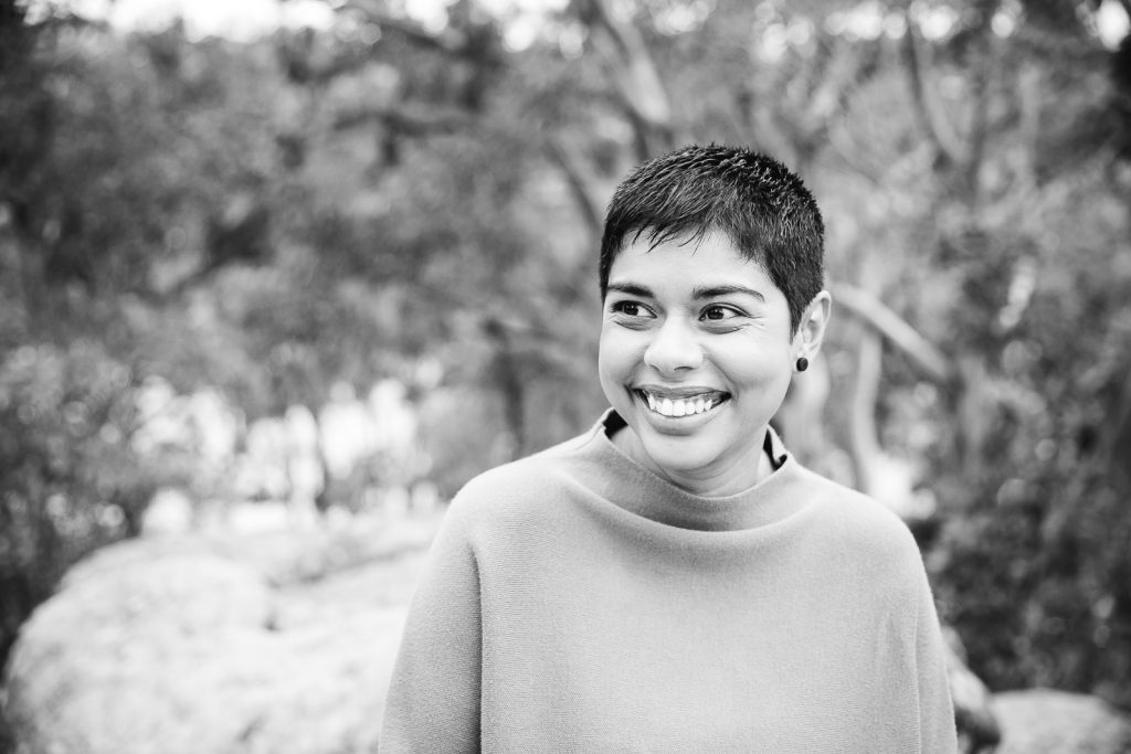 Monochrome landscape — Dinuka McKenzie laughing on rocks