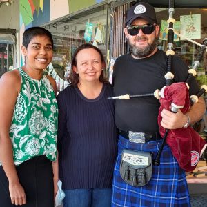 Dinuka McKenzie pictured with Anna Loder and Dave who is carrying bagpipes